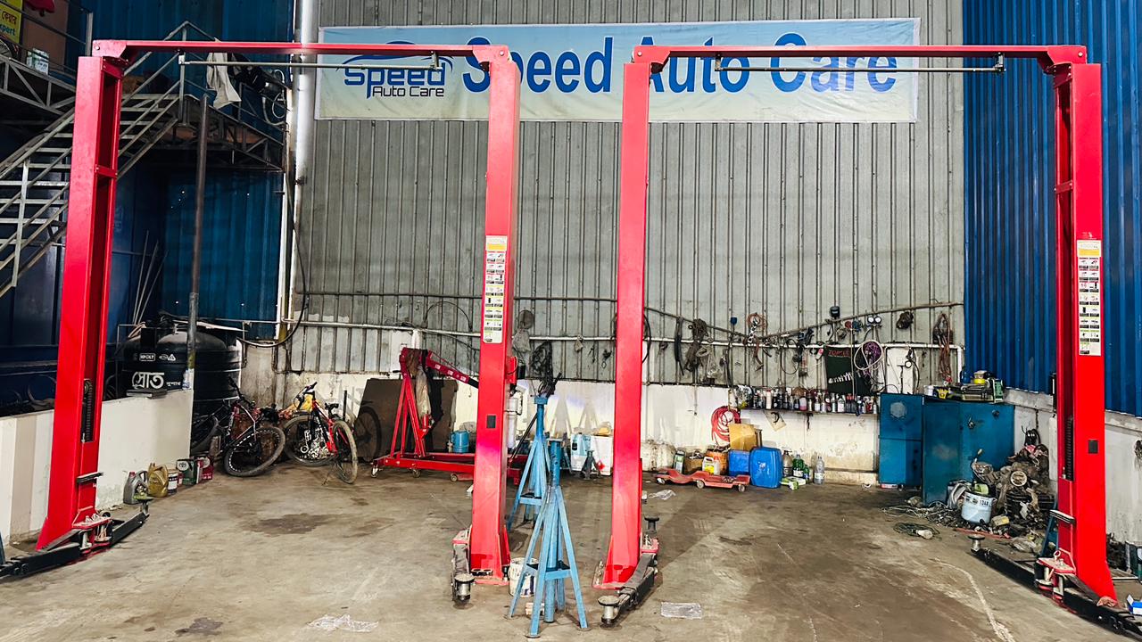 Two-post hydraulic lifters at the Speed Auto Care service bay